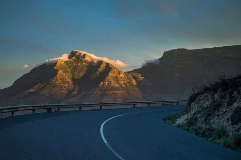Captivating scenic view of a mountain road at sunset near Table Mountain, Cape Town.