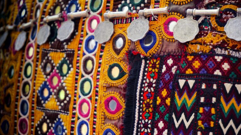 Vibrant handmade textile showcasing intricate patterns and decorative designs with colorful embroidery.